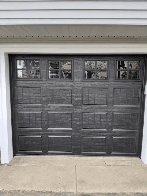Black carriage-style replacement door in Dedham