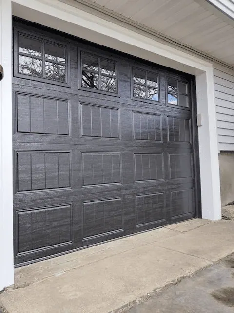 Side view of the black replacement garage door in Dedham