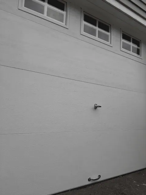 Close exterior view of the replacement garage door in Dorchester