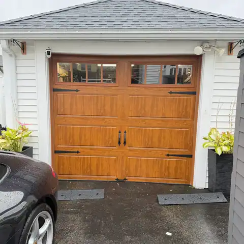 Wood-look carriage-style door with windows