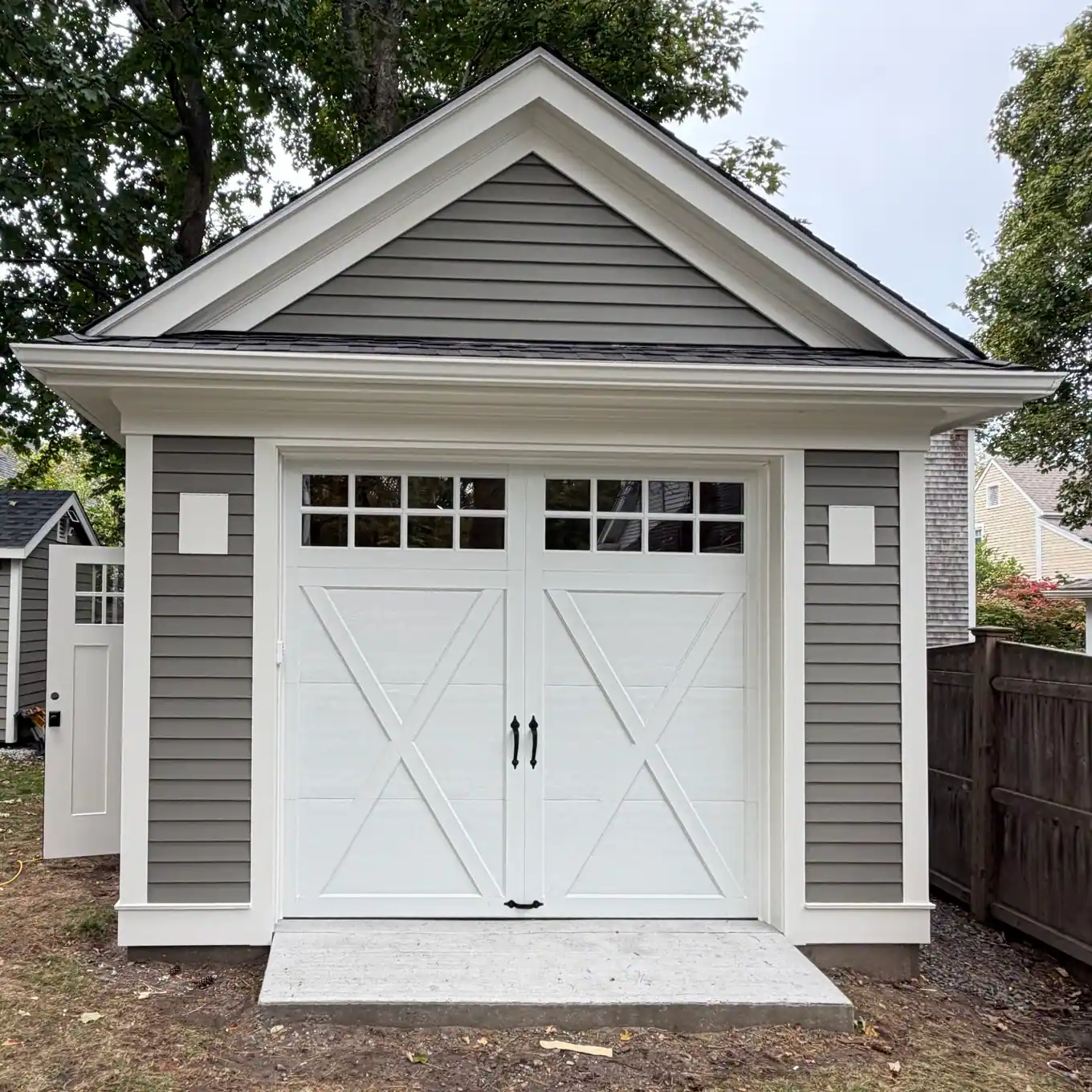 White carriage-style door on a detached garage